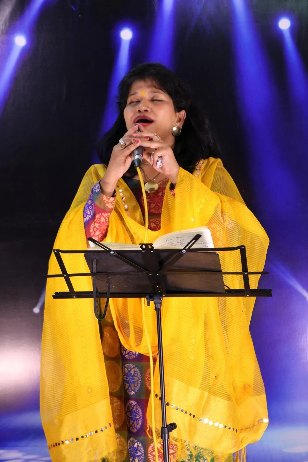 Jyoti Grover, founder of Vocalite, performing on stage